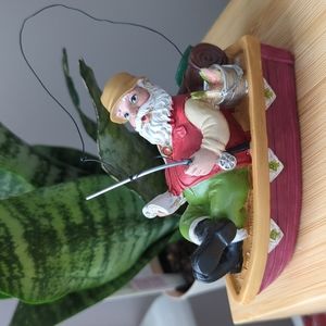 EUC relaxing fisherman Santa ornament